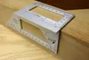 A metal measuring tool is placed on a wooden surface. Produktbild-Vorschau