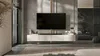 A modern living room with a wall-mounted TV and media console. Produktbild-Vorschau