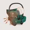 A green baby car seat with a magnified view of its padding and arrows indicating impact absorption. Náhľad obrázku produktu