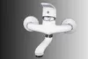 A white wall-mounted faucet against a gradient background. Podgląd zdjęcia produktu
