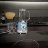 A blue vintage blender sits on a dark countertop in a kitchen setting. Anteprima dell’immagine prodotto