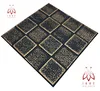 A 3D wall panel with a checkerboard pattern of black and gold squares, presented on a white background. Produktbild-Vorschau