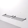 Two black metal wall-mounted drying racks are shown against a white wall. Produktbild-Vorschau