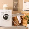 A laundry room scene with a washing machine, a drying rack, and a basket. Produktbild-Vorschau