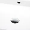 A close-up view of a white ceramic sink with a chrome drain. Produktbild-Vorschau