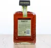 A bottle of Disaronno liqueur on a wooden surface against a white background. Produktbild-Vorschau