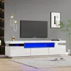 A modern living room with a white TV stand featuring blue LED lighting. Produktbild-Vorschau