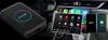 A Carlinkit TBOX LITE S adapter is shown next to a car's dashboard displaying Android Auto and Apple CarPlay interfaces. Produktbild-Vorschau