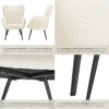 A collage of images showcasing a cream-colored armchair with black legs, highlighting its texture, construction, and design. Produktbild-Vorschau