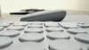 A close-up, low-angle view of a keyboard and a mouse. Produktbild-Vorschau