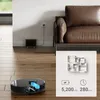 A robot vacuum cleaner is shown on a wooden floor in front of a couch and a wall outlet. A graphic displays floor plan, battery capacity, and runtime. Náhled obrázku produktu