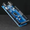 A blue circuit board with various electronic components is shown against a dark background. Anteprima dell’immagine prodotto