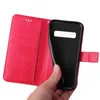 A hand holding a red flip phone case open, revealing the inside of the case and the black phone it is designed to hold. Produktbild-Vorschau