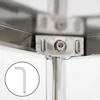 A close-up view of the corner of a metal shelf, showing the connection point between the shelf and a vertical support pole. An Allen wrench is shown in a circular inset in the lower left corner. Náhled obrázku produktu