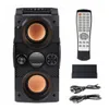 A black portable Bluetooth speaker with orange speaker cones, a remote control, and charging cables on a white background. Náhled obrázku produktu