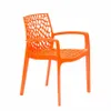 An orange plastic chair with an openwork design. Produktbild-Vorschau