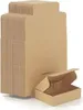 A stack of folded cardboard boxes and one open box in the foreground. Náhled obrázku produktu