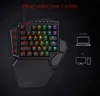 A gaming keyboard with RGB lighting and a wrist rest, shown with icons indicating connection to a laptop and PC. Produktbild-Vorschau
