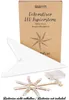 A white paper star and its components are laid out in front of its packaging box. Náhled obrázku produktu
