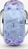 A single Pandora charm with a silver core and a glass bead containing purple and blue elements. Anteprima dell’immagine prodotto