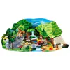 A diorama-style scene depicting a dinosaur expedition with figures, a waterfall, a campfire, and a tent. Produktbild-Vorschau