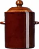 A brown ceramic pot with a lid and handles, isolated on a white background. Anteprima dell’immagine prodotto