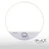 A white, circular LED outdoor wall light with a motion sensor is shown against a white background. The brand name 'max KOMFORT' is visible in the lower right corner. Produktbild-Vorschau