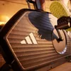 Close-up of an Adidas exercise bike with a person's foot on the pedal. Produktbild-Vorschau