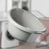 A light gray plastic basin is shown in the foreground, with a blurred laundry room in the background. Produktbild-Vorschau