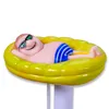A figurine of a man sunbathing on an inflatable pool float. Produktbild-Vorschau