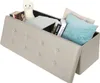 A beige storage ottoman with its lid open, showing books, pillows, and a stuffed animal inside. Náhľad obrázku produktu
