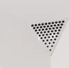 A close-up view of a white triangular acoustic foam panel with a perforated surface, designed for corners. Podgląd zdjęcia produktu