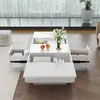 A white rectangular coffee table with drawers open, displaying items inside, in a living room setting. Produktbild-Vorschau