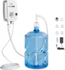 A white electric water dispenser pump mounted on a wall, connected by tubes to a large blue water jug. Several accessories are laid out to the right of the jug. Anteprima dell’immagine prodotto
