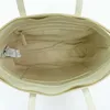 The inside of a cream-colored tote bag is shown. Produktbild-Vorschau