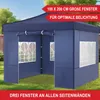 A blue pop-up gazebo with windows, set up on a grassy lawn with trees in the background. Produktbild-Vorschau