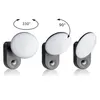 Three views of a white LED light fixture mounted on a gray base, showing its rotational capabilities. Produktbild-Vorschau