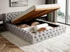 A grey upholstered bed with its storage compartment open, revealing pillows and bedding. Náhľad obrázku produktu