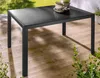 An outdoor table on a wooden deck with plants and grass in the background. Produktbild-Vorschau