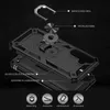 An exploded view diagram of a black smartphone case, showing its layered construction and integrated features like a metal ring and stand. Produktbild-Vorschau