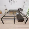 A metal bed frame is shown in a bedroom setting with a trunk underneath and artwork on the wall. Produktbild-Vorschau