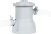 A close-up shot of a gray filter pump with hoses attached. Produktbild-Vorschau