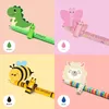 A collage of four different pens with animal-themed toppers, each presented in a separate quadrant with a colored background and a small color swatch. Produktbild-Vorschau