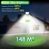A house at night with a bright floodlight illuminating the roof and yard. Produktbild-Vorschau