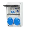 A white electrical distribution box with a transparent lid, showing circuit breakers and two blue electrical outlets. Produktbild-Vorschau