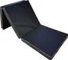 A folded black mattress lying on a white background. Podgląd zdjęcia produktu
