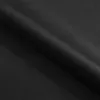 A close-up view of black fabric, possibly velvet or a similar textured material, with soft lighting creating subtle highlights and shadows. Náhled obrázku produktu