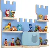 A blue wooden fortress-shaped wall shelf filled with various children's toys and figurines. Náhled obrázku produktu