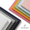 A stack of colorful fabric swatches, likely representing different colors of bedding or textiles, arranged diagonally. Produktbild-Vorschau