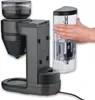 A coffee maker with a removable water tank being inserted by a hand. Produktbild-Vorschau